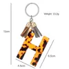 Nyckelringar Akrylbrev Tassel Keychain Tillbehör Kvinnor och flickor Guldnyckel Aätsyra Leopardtryck Pendant Lämplig för bilnycklar G230525