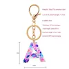 Keychains schattige creatieve kristal aroma stenen brief vrouwelijke ring auto tas charme hanger sleutelhanger g230525