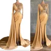 Sexy Gold Evening Dresses Wear Jewel Neck Illusion Mermaid Side Split Lace Appliques Crystal Beaded Pearls Long Sleeves Feather Formal Party Dress Prom