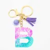 Keychains schattige creatieve letter Crystal Aramid Liquid Women's Keychain Ring Car Bag Tassel hanger Charm Gift Accessoires G230525 Goed