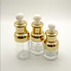 Récipient de bouteille de lotion en verre clair de vente chaude pour les bouteilles d'huile essentielle en verre de cosmétique 20ml 30ml 50ml avec le chapeau d'or de pipette