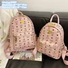 Bolso de hombro para mujer al por mayor de fábrica 2 bolso de moda de dibujos animados lindo bolso de ocio de cuero de contraste grande resistente al desgaste mochilas de remaches populares de la calle 9313 #