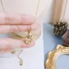 Naszyjniki wiszące ze stali nierdzewnej nierdzewne Słynne kobiety marka projektantka litera 18k złota platowana naszyjnik klawałowy Inkrustowany kryształowy prezent biżuterii