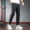 Pantaloni da uomo 2023 Pantaloni sportivi sportivi a righe primavera ed estate Tendenza Tutto Pull Rope Bundle Feet Harlem Casual Men