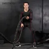 Abbigliamento da palestra Tuta da allenamento sportiva attillata da uomo Running Traspirante Stretch Pantaloni a maniche lunghe ad asciugatura rapida