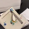 Carteras Carteras de alta calidad Titular de la tarjeta Titular de las mujeres para hombre Diseñador de lujo Titulares de tarjetas de luz Cuero real Ranura para tarjeta con cremallera Monedero Clase