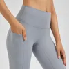 Pantalon actif couleur unie Fitness Leggings mode Yoga sport Sexy femmes nue sans couture sain poches latérales doux et respirant