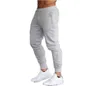 2023Fashion Brand Logo Logo Мужские спортивные спортивные брюки Joggers Fitness повседневные длинные брюки Мужчины Тренируются худые спортивные штаны.