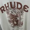 デザイナーファッション衣類 Tシャツ Tシャツ Rhude ハイストリート夏フラワープリントヒップホップ半袖カップルルーズ半袖 Tシャツトレンドコットンストリートトップスカジュアル