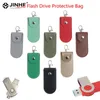 Casos 1pc Bolsa bolsa de bolsa protetora cobertura de couro Tecultor de anel de chave para uso flash de flash pendrive Memory Stick OTG U Bags de armazenamento em disco