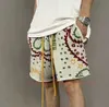 Designer Kort Mode Fritidskläder Strandshorts Rhude Cashew Flower Shorts för män med en nisch Designkänsla High Street Trend Hem Sport Fritid Lössittande C