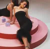2023 femmes élégantes robes de soirée noires sans bretelles dos nu moulante robe d'été Sexy Corset haut robe mi-longue avec plume