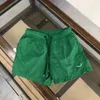 Pantaloncini dritti da uomo in seta di ghiaccio alla moda estiva per pantaloncini da spiaggia larghi con coulisse sottile da uomo Pantaloncini casual a cinque punte coreani 54