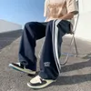 Pantaloni da uomo Harajuku Pantaloni sportivi lunghi casual a righe Tipo allentato Tide Youth