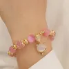 Charm-Armbänder, rosa Opal-Anhänger, Perlenarmband, Qiu Dong, weiblich, Ins-Temperament, kontrahierte Schnur auf dem Stil