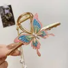 Andere kleurrijke haarklauw voor vrouw Girls Geometrische haarspeld Butterfly Tassel Grap Clip Bekeld Hoofdtooi Haar