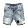 Джинсы Рваные джинсовые шорты Мужские голубые пятые брюки Модные универсальные свободные шерстяные шорты с разрезом