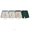 Mäns shorts modemärke Rhude Ethnic Cashew Jacquard Sticked Wool Casual Shorts for Men and Women's American High Street Capris