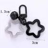 Färgglad akryl ihålig pentagram nyckelring hänge med klocka färskt tillbehör bilväska nyckeldekoration