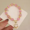 Charm-Armbänder, rosa Opal-Anhänger, Perlenarmband, Qiu Dong, weiblich, Ins-Temperament, kontrahierte Schnur auf dem Stil