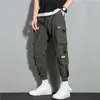 Брюки Новый хип-хоп jogger Cargo Harem Multi Pocket Ribbon Мужская спортивная улица Спортивная улица. Мужские брюки P230529