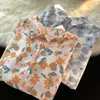 Chemisiers pour femmes Corée Floral Imprimé Chemises Hommes D'été Boutonné Surdimensionné Chemise À Manches Courtes Vintage Plage Hawaii Vêtements Japonais Tops