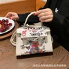 Bolsa coreana de moda feminina Novo 2023 líquido de graffiti vermelho mensageiro Modans de desenho animado Bolsa de ombro 230529