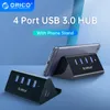 Hubs Orico 5 Гбит / с высокоскоростных Mini 4 Ports USB3.0 Splitter для настольного ноутбука с держателем подставки для телефона планшета Black / White