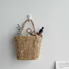 سلة Mini Weaving Flower Basket سلة تخزين محمولة للديكور المنزلي غذاء العشب منظم التصوير الفوتوغرافي الدعائم تخزين الجدار