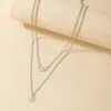 Enkel rund bit fågel svälja flerskiktshänge halsband för kvinnors geometriska metall dubbel lager i halsbenhalsbandet