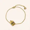 2023 nouveau designer bijoux bracelet collier anneau accessoires titane acier huile bouteille de parfum ensemble femmes doubles boucles d'oreilles