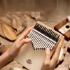 Piano de polegar pau-rosa kalimba iniciante instrumento musical portátil de 17 tons com estojo