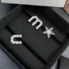 Letter miu diamond studded tassel asymmetric diamond studded pendant earrings pentagram S925 silver needle earrings