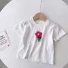 Set di abbigliamento Summer Girls Short Skirt Set Flower T-shirt a maniche bianche Mezza 2 pezzi Moda bambino per bambini