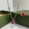 2023 Nouveau designer bijoux bracelet collier anneau émail Bracelet utilisé de la colle tombant rouge amour pêche coeur chaîne de la clavicule pour hommes femmes