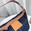 Sacs à bandoulière en denim Sac sous les bras de mode unisexe Fourre-tout de grande capacité Sacs à main de créateur Sac à main Bretelles en cuir véritable Pochette de fermeture à glissière doublée en toile