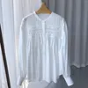 Camicette da donna Camicia a pieghe tinta unita da donna francese 2023 Camicetta allentata a maniche lunghe monopetto con orlo asimmetrico da donna estiva