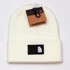 Chapéu de gorro engrossado acrílico malha inverno tendência quente borda laminada quente designer de esqui masculino e feminino chapéus