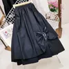 Spódnice 2023 Autumn Black Womens Korean Fashion Solid Kolor Big Swing Kobietowe spódnica długa urocza łuk w talii