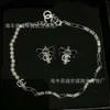 24SS Designer Channel Xiaoxiangfeng 2023 Ny kändisstil Silverbrev Bow Halsband örhänge Set Internet röda örhängen