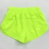 Alinhe lu shorts limão yoga feminino solto zíper lateral bolso ginásio treino correndo cordão ao ar livre curto anti-reflexo shorts jogger