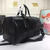 Sac de bagage de week-end vacances sac fourre-tout de luxe concepteur unisexe sacs de sport Boston sac fourre-tout en cuir véritable femmes hommes sacs à main grande capacité étiquette de bagage longue sangle