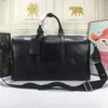 Sac de bagage de week-end vacances sac fourre-tout de luxe concepteur unisexe sacs de sport Boston sac fourre-tout en cuir véritable femmes hommes sacs à main grande capacité étiquette de bagage longue sangle