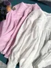 Camicette da donna Camicia a pieghe tinta unita da donna francese 2023 Camicetta allentata a maniche lunghe monopetto con orlo asimmetrico da donna estiva