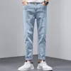 Jeans da uomo Moda Uomo Pantaloni a nove punti Autunno Inverno Pantaloni sportivi in denim casual Pantaloni Abiti firmati