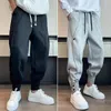 Pantaloni da uomo Pantaloni sportivi da uomo semplici Bottoni elastici in vita Pantaloni traspiranti a vita media allacciati alla caviglia