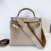 En Kelyys Bag Leather Women's 2024 New Togo Top Layer Cow High Grade Wide Shoulder Strap Single Messenger Handbag