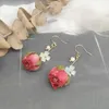 Orecchini pendenti Elegante orecchino rosa immortale per le donne Resina epossidica fiore naturale Ragazze uniche Veri gioielli floreali all'ingrosso