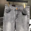 Men's designer jeans new 2023 spring and autumn winter light luxury calf elastic trend men and women metal letter jeans