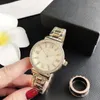 腕時計ファッションブランドのラインストーン女性の時計カジュアルスポーツクォーツマンローマ銀ブレスレットステンレス鋼の時計工場販売